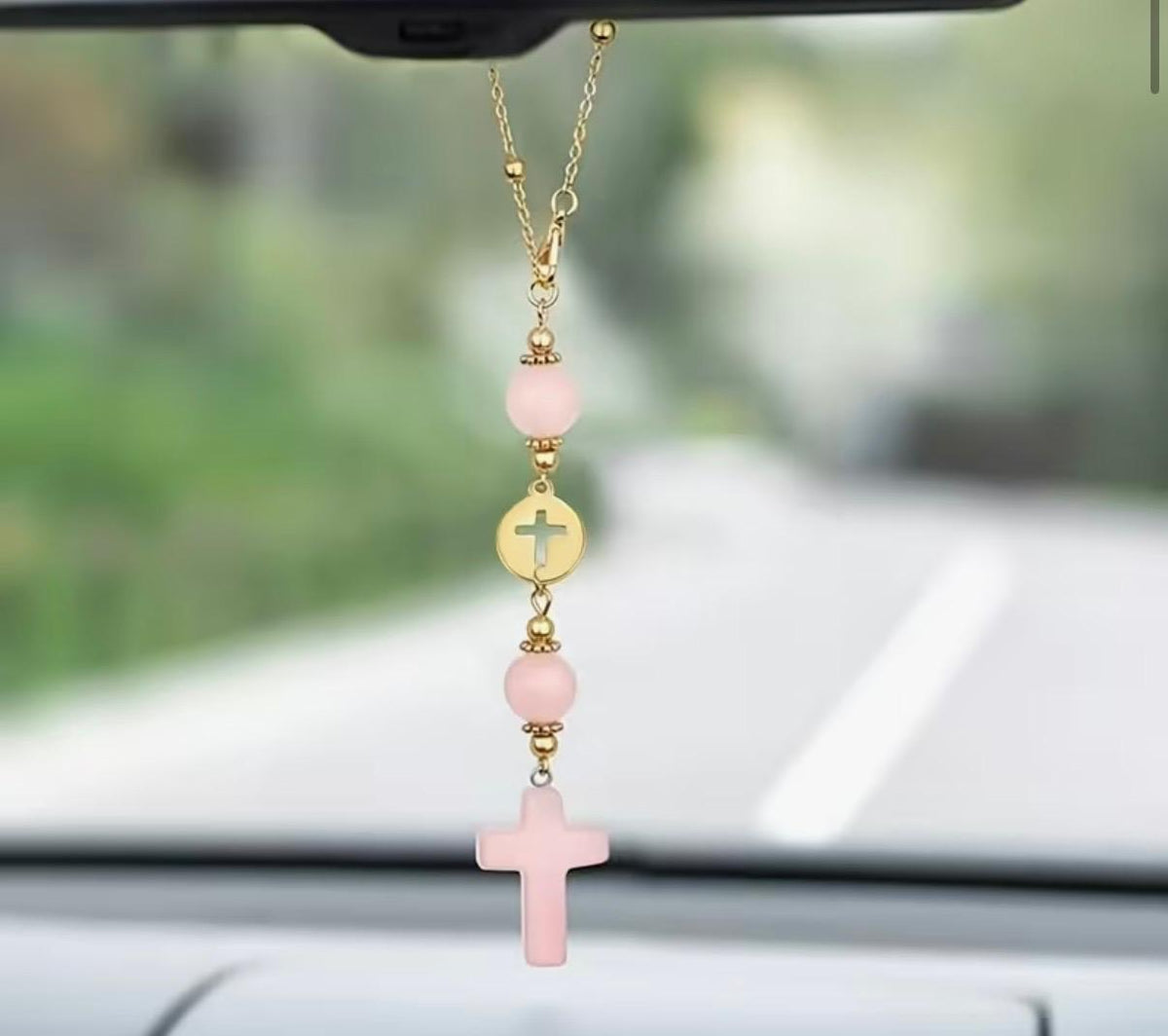 Car visor decor with pink cross and gold charm