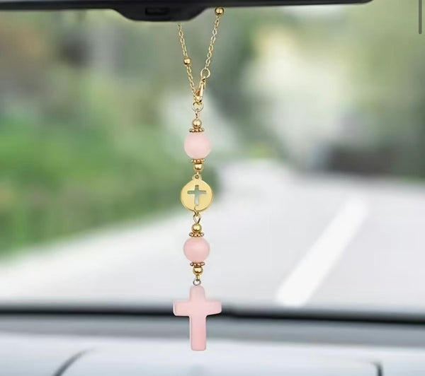 Car visor decor with pink cross and gold charm